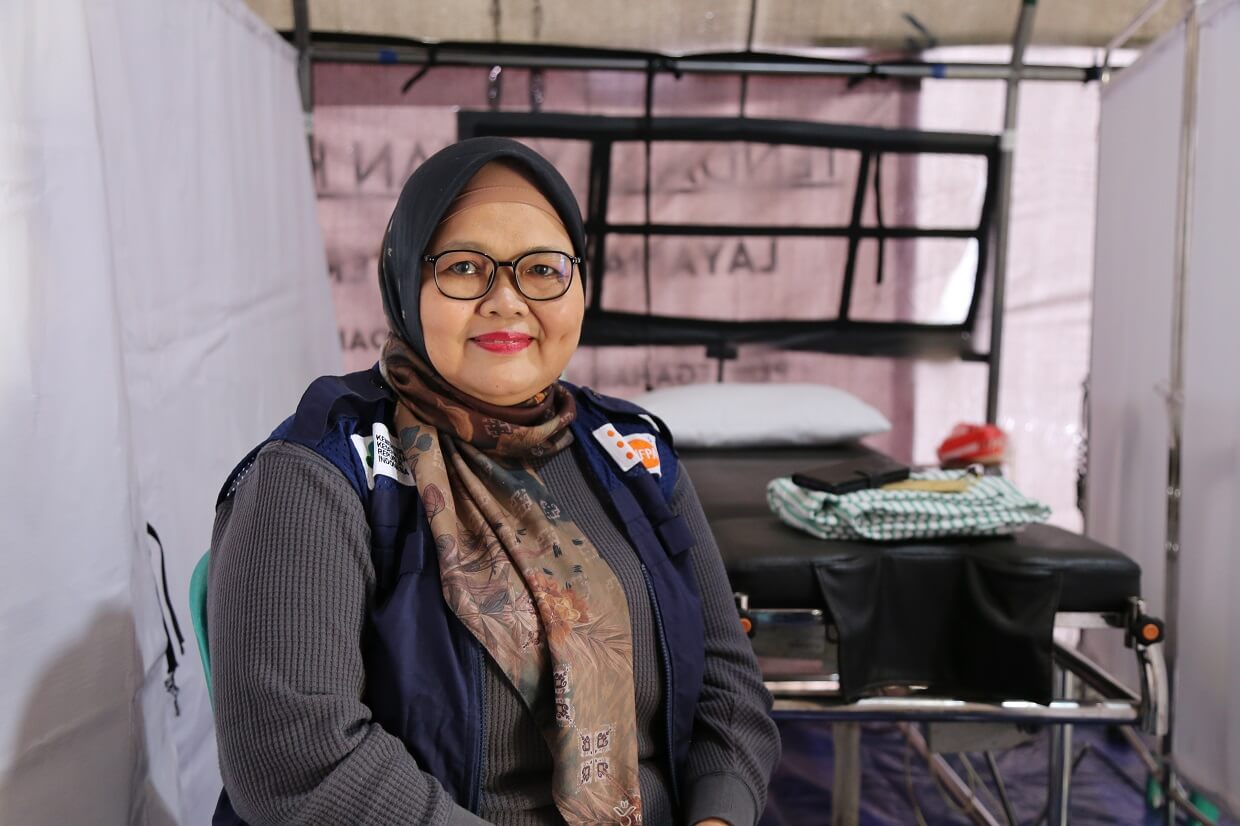 Sri Rezeki Utami Midwife in Disaster Response - UNFPA Indonesia