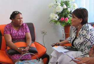 Head of Jayapura District Planning Agency Hanna Hikoyabi (left) discusses elimination of violence against women and girls with UNFPA Representative Dr. Annette Sachs Robertson.